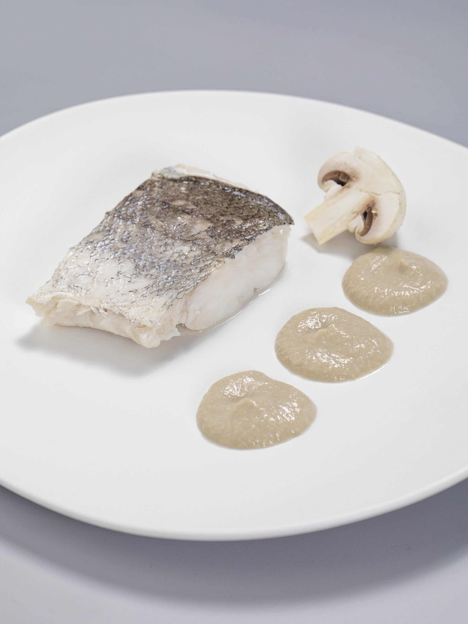White fish en papillote with mushroom sauce